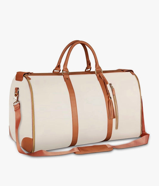 Beige duffel bag with brown leather straps